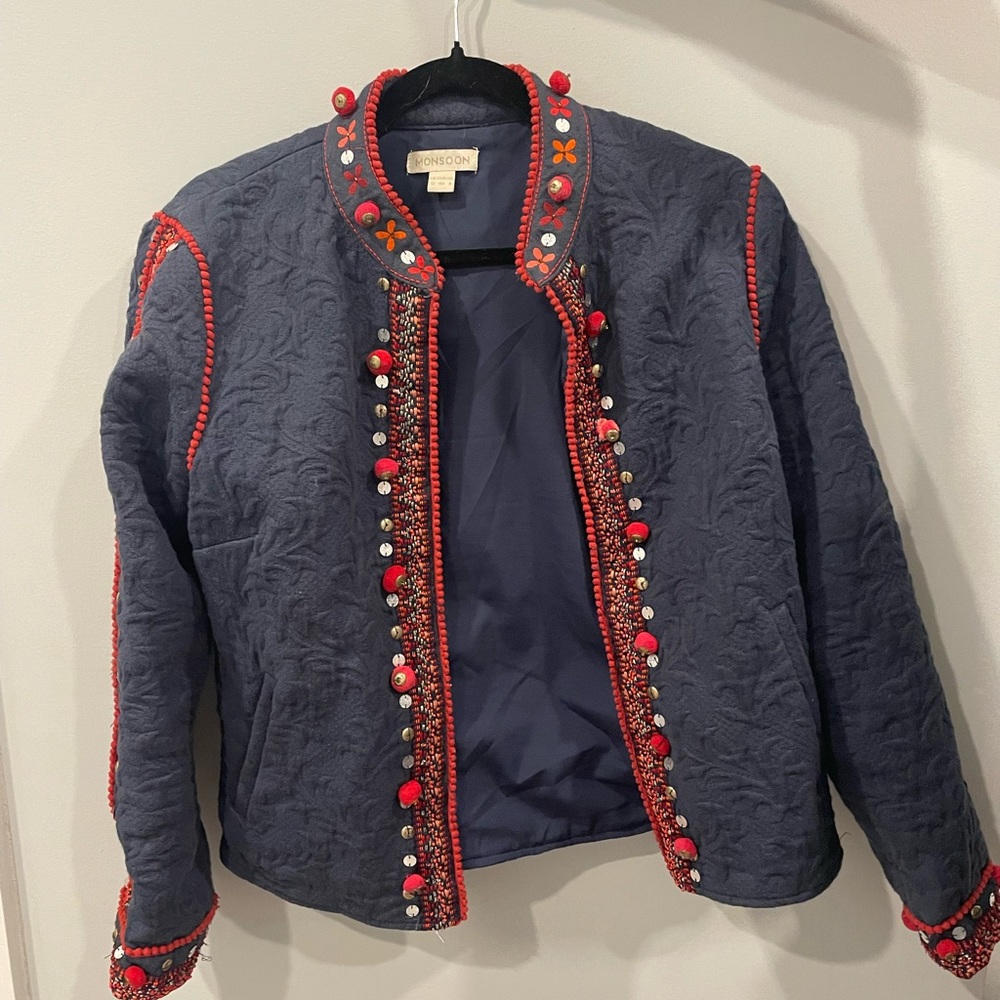 Detailed navy and red with metal embellishments jacket